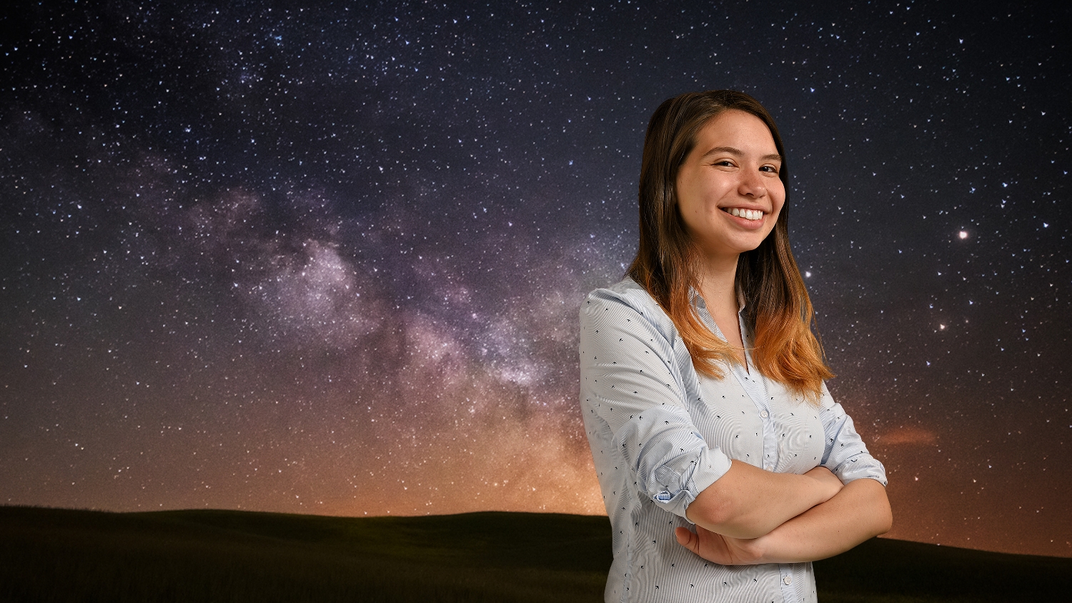 Ana Sofia Uzsoy stands in front of a starry sky backdrop.